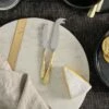 Osko Cheese & Butter Knife Set - Brushed Gold (Set Of 2) 1 Osko Cheese & Butter Knife Set - Brushed Gold (Set Of 2) -furniture Sales Store nkuku osko cheese butter knife set brushed gold set of 2 5055672454694 29761617100976